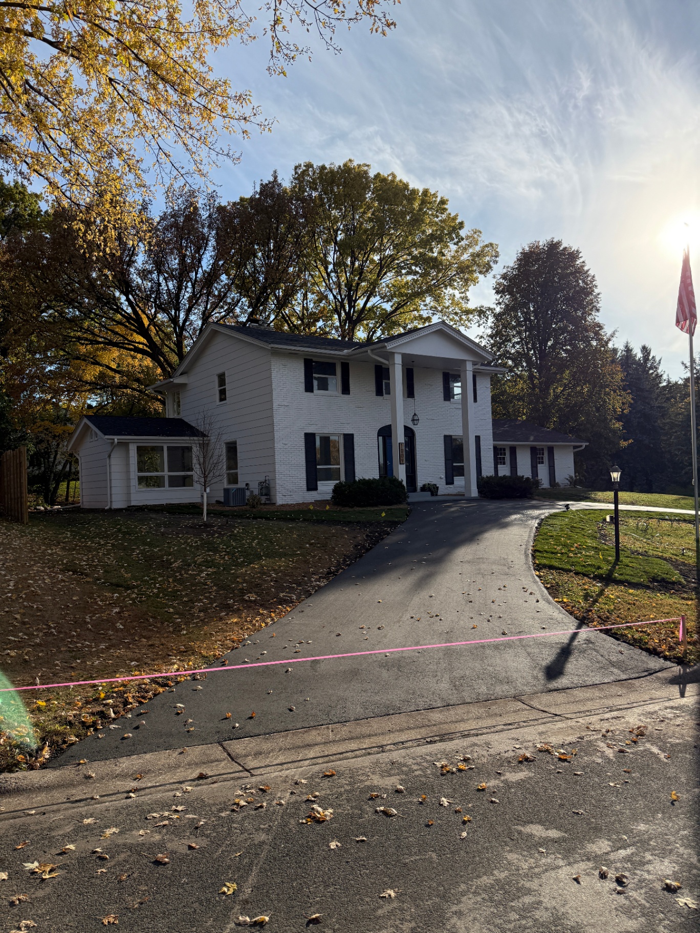 1009 Knob Hill Road, Burnsville, MN — front elevation with new GAF Timberline HDZ charcoal roof and new asphalt driveway