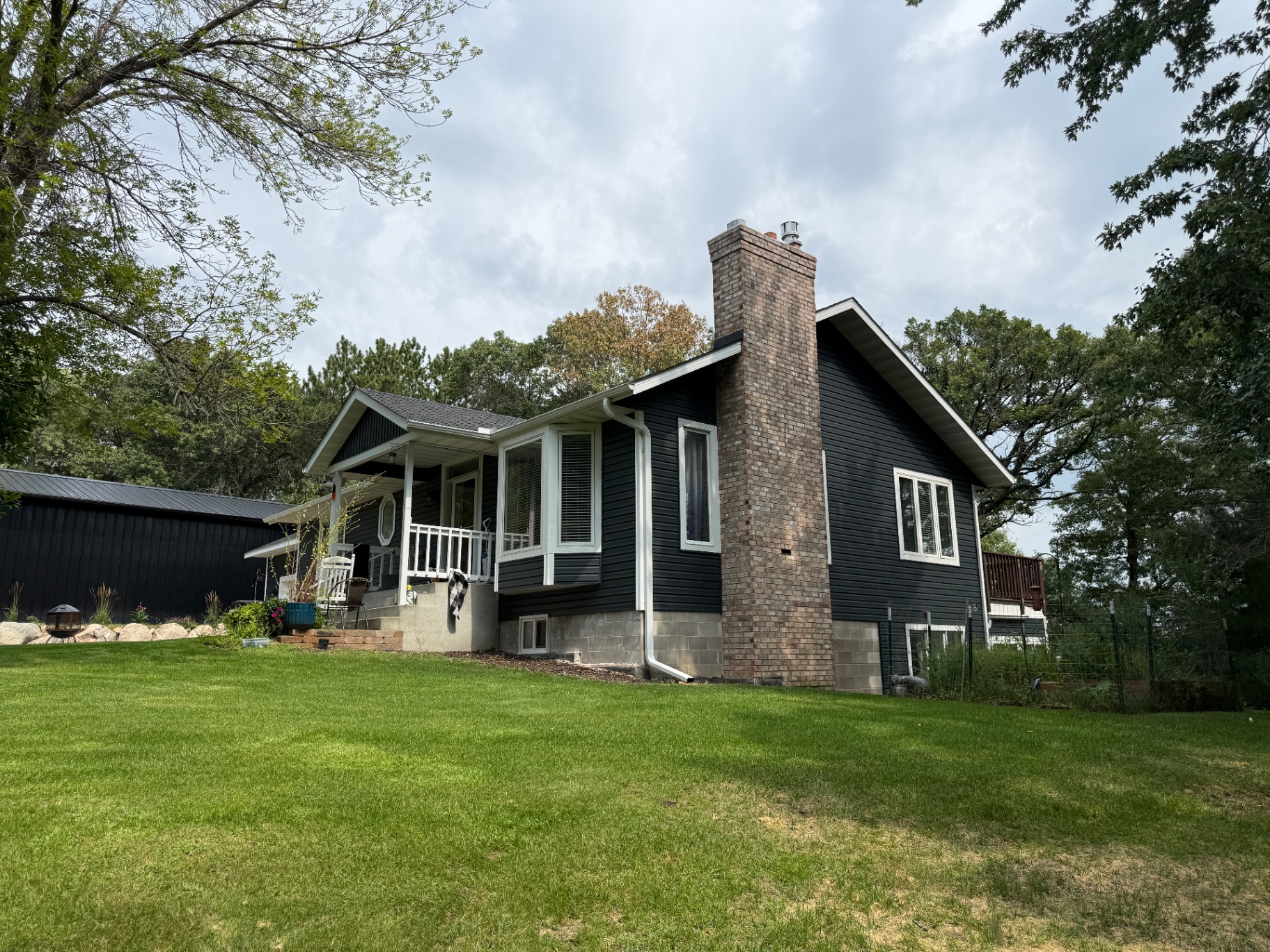 Elk River, MN side elevation after construction showing white corner accents and the new Brunswick siding