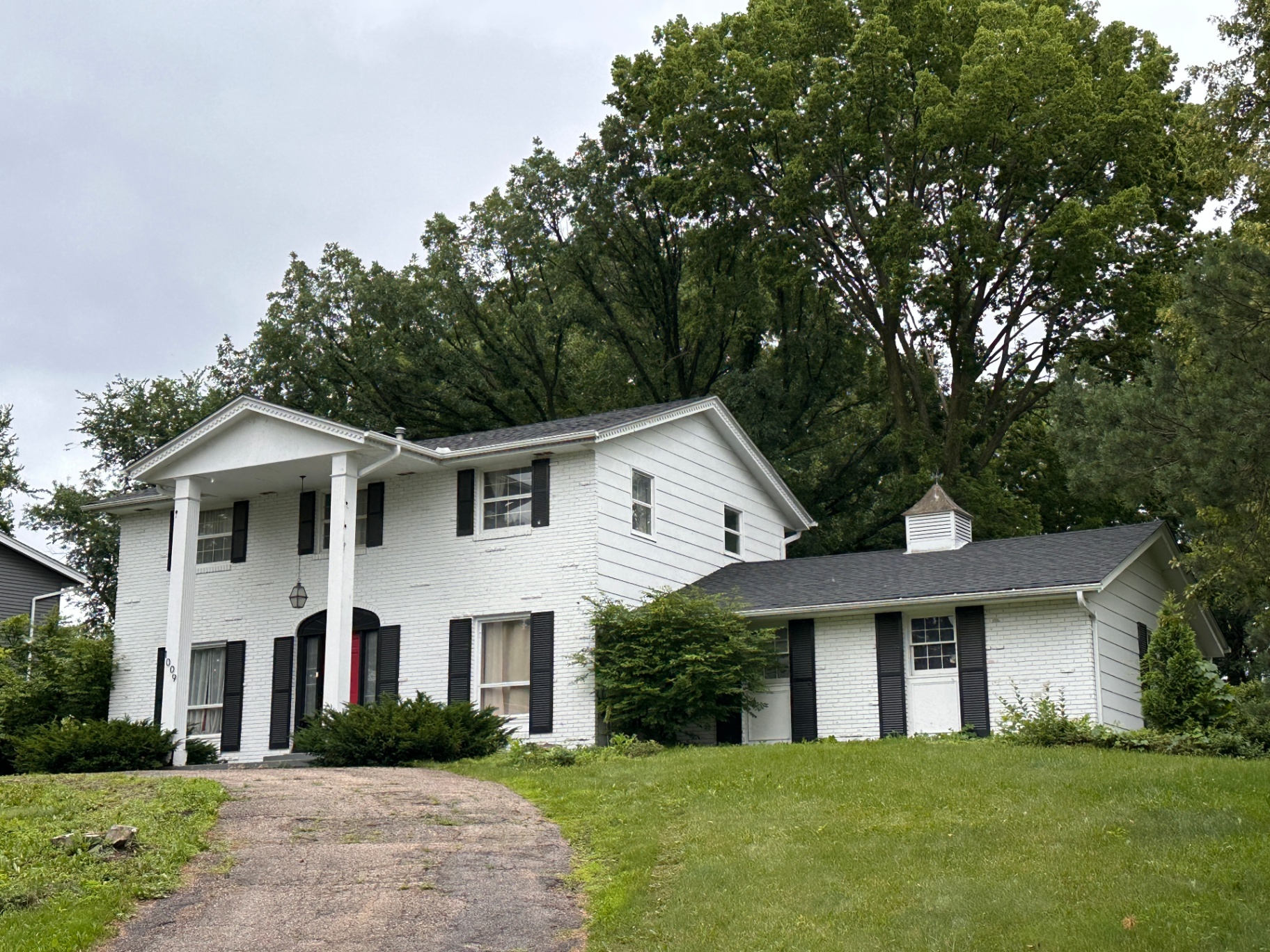 1009 Knob Hill Road, Burnsville, MN — GAF Timberline HDZ charcoal roof on a two-story brick colonial
