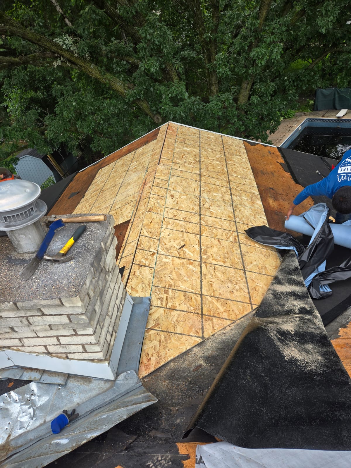 New plywood decking installed and underlayment being rolled out in Burnsville, MN